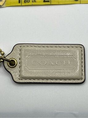 Coach Shimmering Cream Leather Hang Tag with Gold Chain